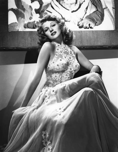 Rita Hayworth. The actress lounges on the set of You Were Never Lovelier wearing a dress that *just about* frees her nipples. Pretty scandalous for 1942, and you know 2017's naked dresses could never.